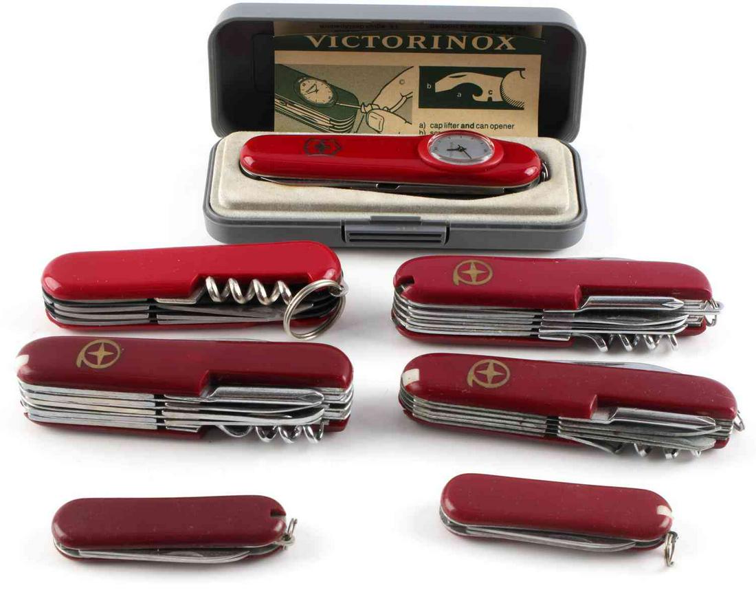 LOT OF 7 VICTORINOX & SWISS ARMY STYLE KNIFE: Lot of 7 includes: one (1) 3.5-inch Swiss Army "Victorinox" knife in original case (features wind-up clock on the front with the standard multi-tool accessories), and six (6) Swiss Army-style multi-to