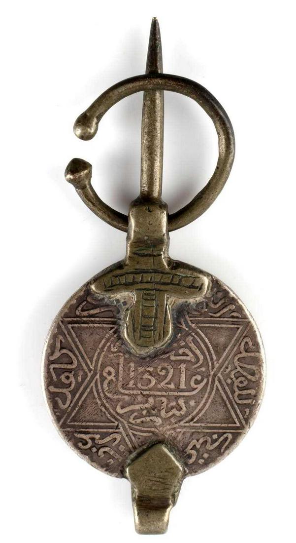 ANTIQUE MOROCCAN BERBER SILVER COIN PENDANT: Large Antique Moroccan Berber Silver Coin Fibula/Pendant. Length 3 1/2 inches, width 1 1/2 inches.