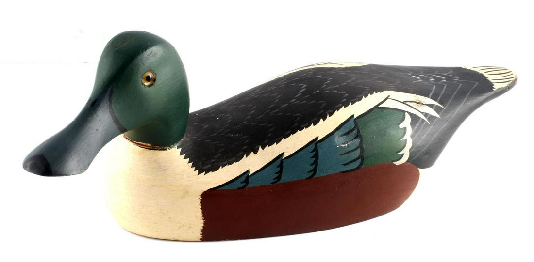 ANTIQUE HANDPAINTED WILDFLOWER DUCK DECOY: Glass eyes, green, blue, brown, black, white feathers. Wildflower stamped. Measures 15 X 5 inches. Minor dent to right side. Very good condition.