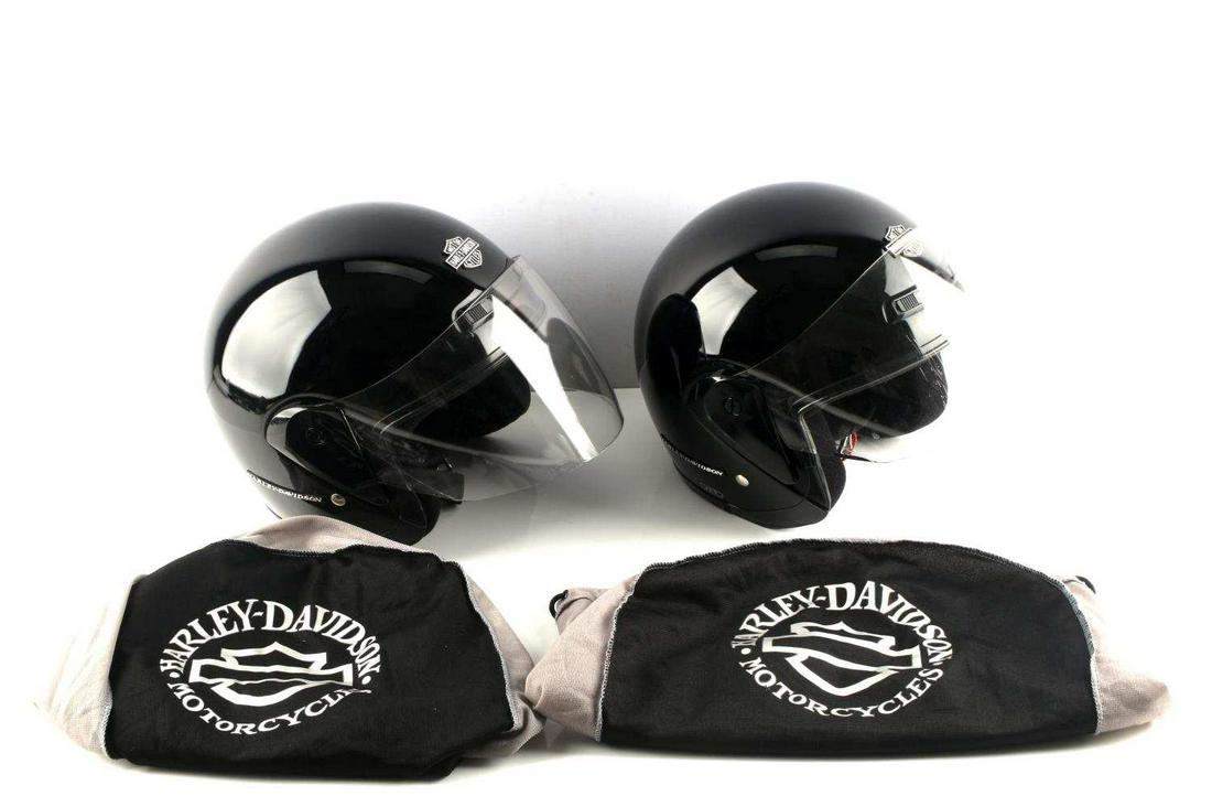 LOT OF 2 HARLEY DAVIDSON BIKER HELMETS WITH BAG: Lot of 2 Harley Davidson biker helmets with carrying bags. Both have some scratching but overall excellent condition. Helmets measure 12 X 8 inches. Visors measure 6 X 9 inches.