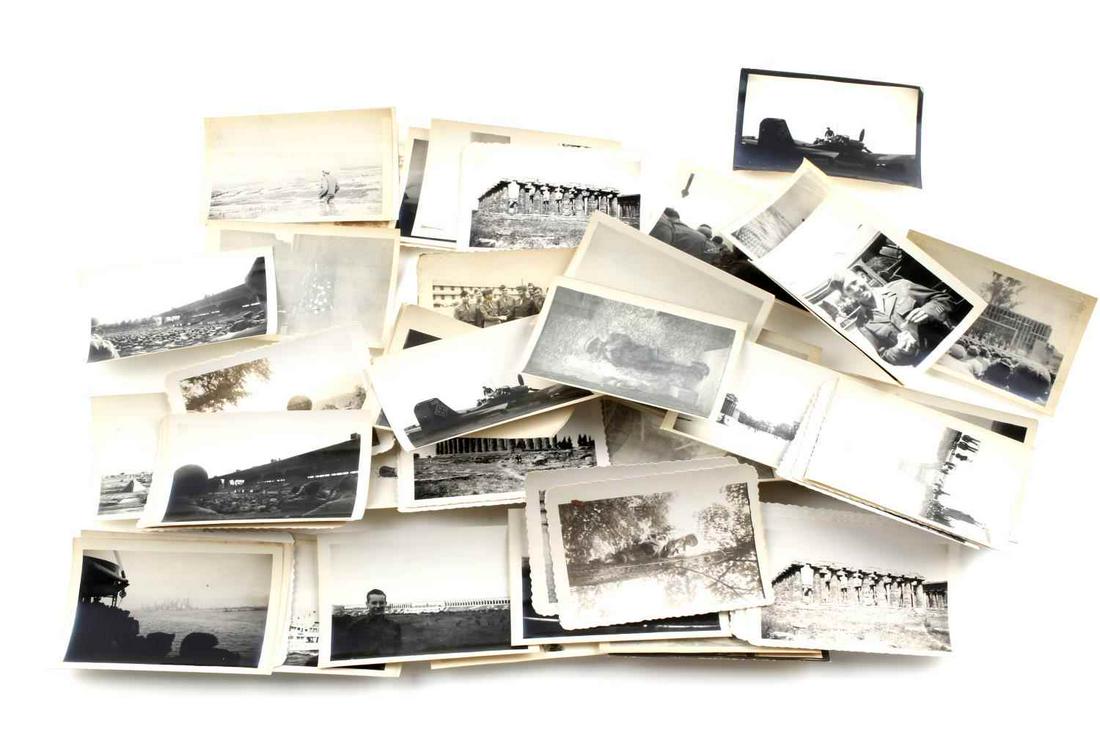 LOT OF 70 WWII PHOTOS TAKEN BY GI EUROPE GERMANY: Lot of 70 photo taken by GI during WWII. Includes small 3.5 X 2.5 inch black and white photos of downed German planes, GIs, battle landmarks, Eiffel Tower, soldiers at down time, churches, coliseum, a