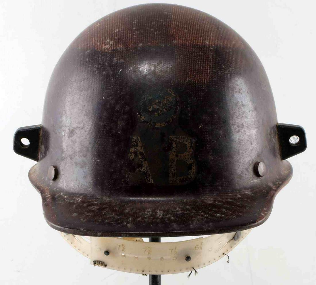 MSA US MILITARY 8TH DIVISION AB HELMET LINER BROWN: Brown MSA helmet liner with AB to front and US8 above in blue circle. Class C liner label to interior. Plastic frame is coming loose. Fair condition.