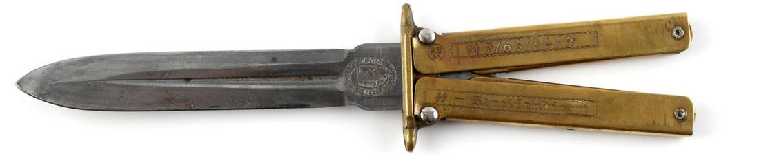 WWII GERMAN WAFFEN SS BUTTERFLY COMBAT BOOT KNIFE: WWII German Waffen SS Butterfly Combat Boot Knife. Measures 7 13/16” long overall with the blade open. Measures 1 9/16” wide by 5 3/4" long closed. The front is maker marked ‘RZM M7/66/34 SS SS 