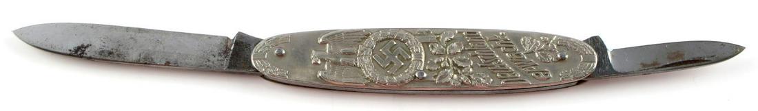 WWII THIRD REICH GERMAN FOLDING POCKET KNIFE: One side has image of Hitler and his name below, other side has eagle and swastika, "Deutschland erwacht" with design in relief. Two blades, little oxidation. Good condition overall. Measures 3.5 inch