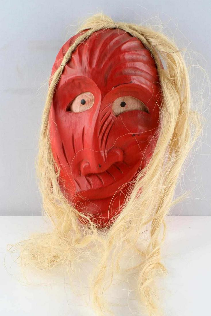 IROQUOIS HAND CARVED FALSE FACE SOCIETY MASK: Red with horse hair, unsigned and age indeterminate. Measures 13 inches. Very good, original condition.