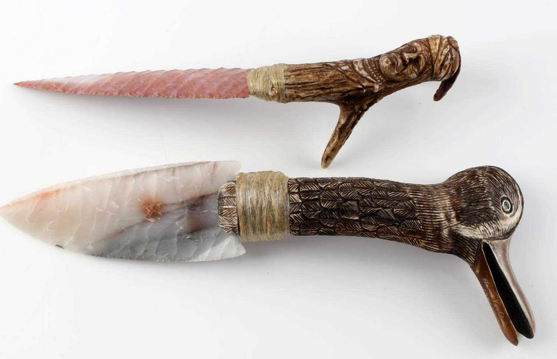 2 CLAUDE VAN ORDER HAND CARVED CHERT FLINT KNIFE: Two river chert knives hand carved and knapped by Claude Van Order. Dated 1994, near mint condition. Duck head knife measures 11 1/4 inches long. Blade measures 5 X 2 inches and handle measures 6 3/4