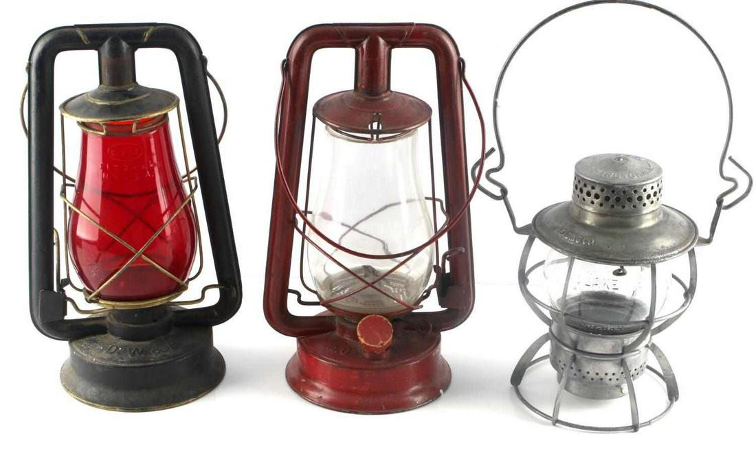 3 ANTIQUE RAILROAD LANTERNS RUBY ADLAKE DIETZ: Lot of 3 lanterns includes Dietz ruby globe, Delaware , Winnipeg, Pacific RR, clear Adlake globe Reading Railroad , and a red WPA stamped base possibly Works Parks Admin. all very good and original.