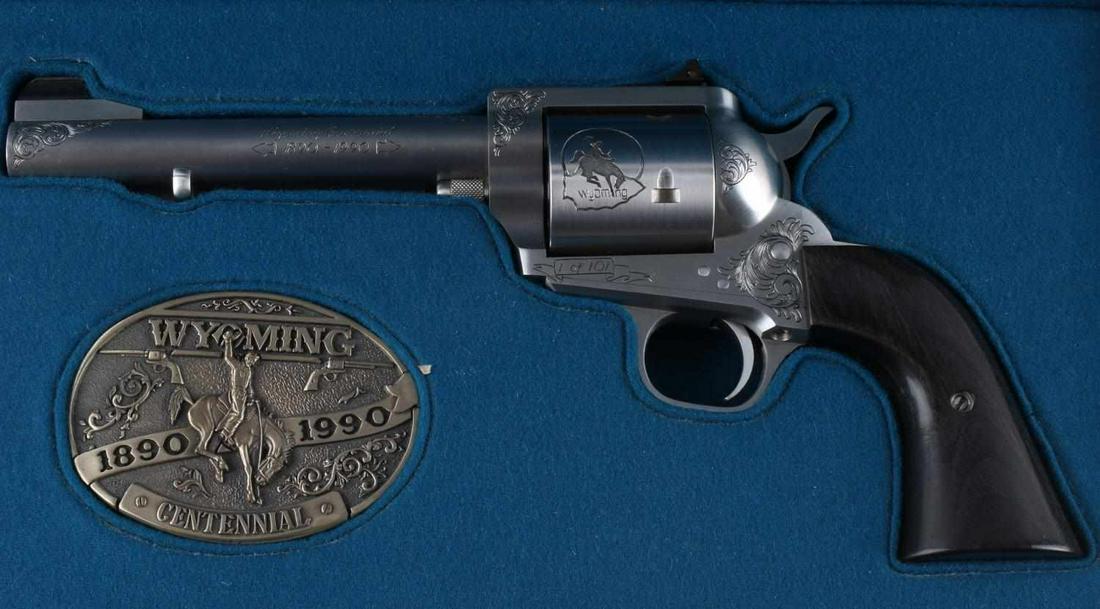 FREEDOM ARMS 1 OF 100 454 CASULL WYOMING REVOLVER: Celebrating the centennial of Wyoming Statehood, engraved by Lisa Tomlin, 1 of 100, 6 inch barrel, S/N Wyo-1938, black laminate grip, appears mint condition but a target is included with tight pattern