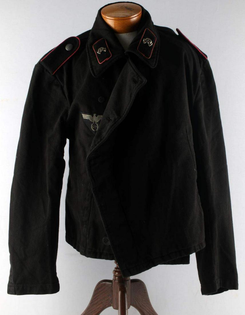 WWII GERMAN THIRD REICH PANZER WRAP TUNIC: Panzer wrap tunic. Late war ribbed twill material. Triangle breast eagle with pink piped tabs and shoulder boards. Does not fluoresce. This lot has a reserve.