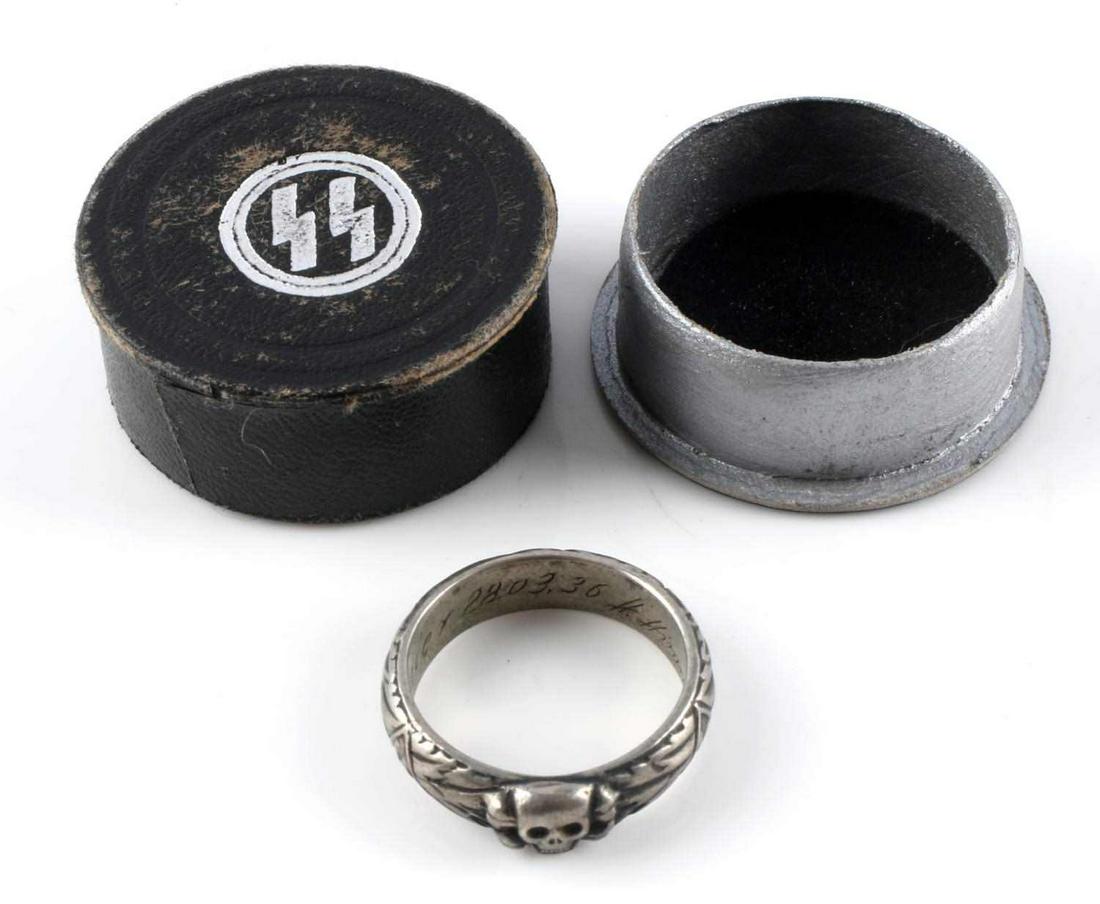 WWII THIRD REICH GERMAN SS TOTENKOPF OFFICER RING: Totenkopf at front center, engraved design throughout, J. Maier 28.03.36 H. Himmler engraved inside band. Size 12, weighs 9.6 grams. Tests as silver, however, not marked. Comes in SS issued case. Very