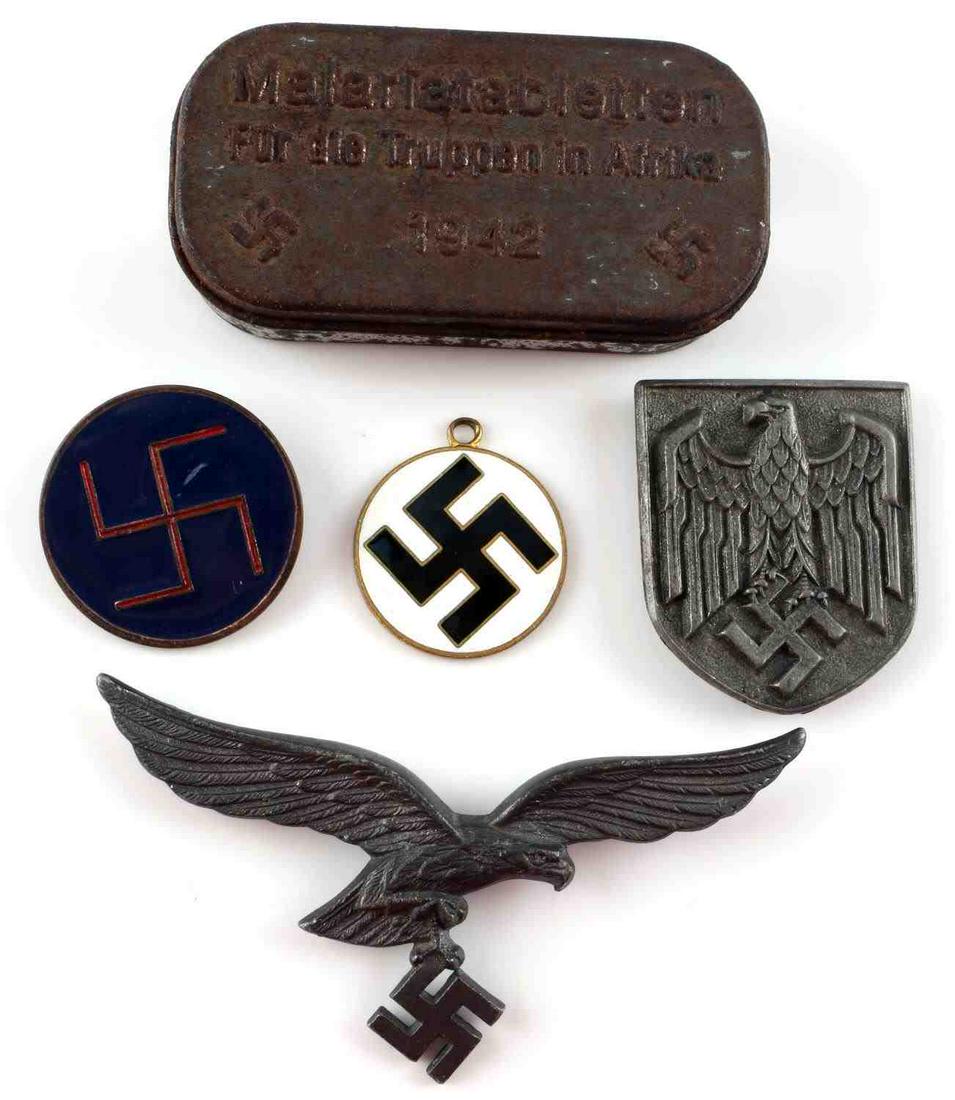 WWII GERMAN LUFTWAFFE MIXED LOT W BREAST EAGLE: Lot includes: Luftwaffe chest eagle (missing pin) (marked A for Assman), enamel swastika pin, enamel swastika pendant, Heer pith helmet eagle with 3 prongs at back, and a malaria tablet metal containe