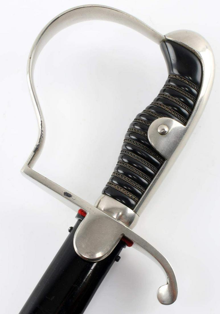 IMPERIAL GERMAN PRUSSIAN ARTILLERY BLUCHER SABER: Side-by-side King's Head and Knight's helmet WK&C maker mark. Plain nickel-plated hilt shows light surface wear to dove head pommel, plain knuckle-bow and crossguard with several spots of light liftin