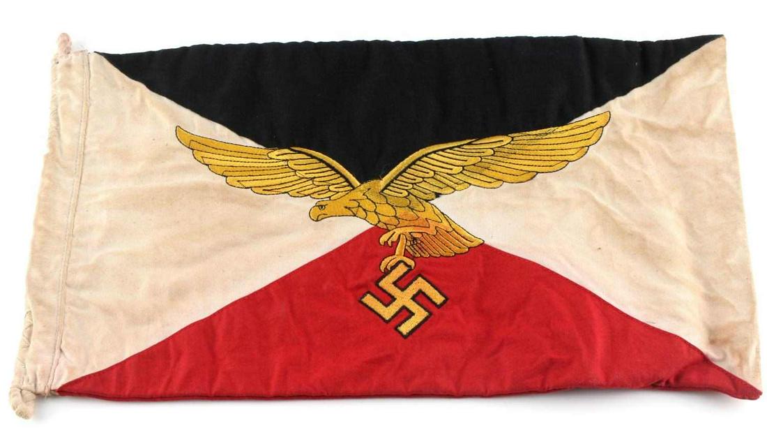 WWII GERMAN LUFTWAFFE GENERAL FENDER FLAG PENNANT: Luftwaffe eagle embroidered in gold to both sides, amid German colored flag, hook at each end for hanging. Measures 15.5 X 9 inches. Very good condition. Does not fluoresce under blacklight. This lot 