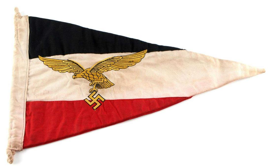 WWII THIRD REICH GERMAN LUFTWAFFE CAR PENNANT: Luftwaffe Commander of Flight Division car pennant. Gold embroidered eagle and swastika outlined in black, to both sides. Measures 15.5 X 10 inches. Very good condition. Does not fluoresce under black