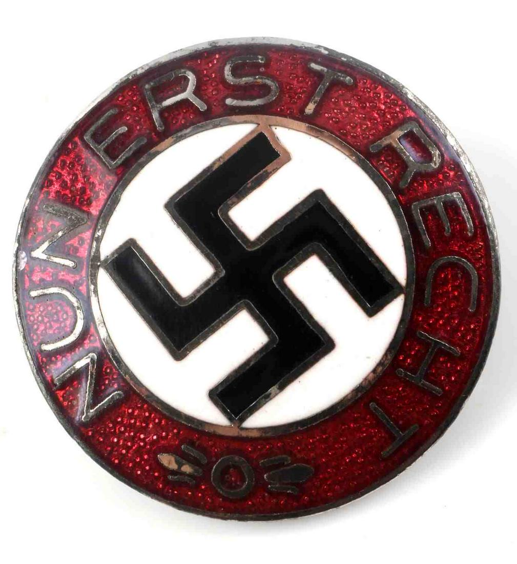 WWII GERMAN THIRD REICH NUN ERST RECHT LAPEL BADGE: German WWII Nun Erst Recht Swastika Lapel Badge. Measures 7/8” in diameter. The front reads ‘Nun Erst Recht’. There is a swastika in the center. The reverse side is maker marked ‘RZM M1/4 ges 