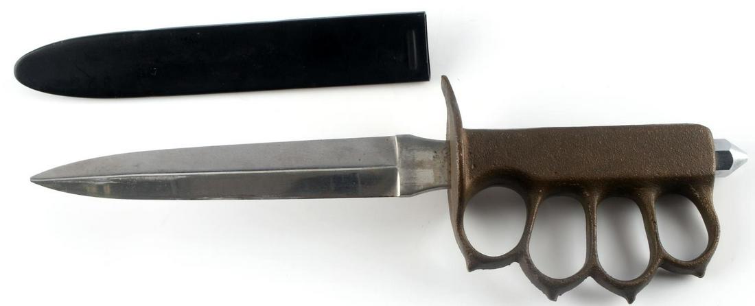 WWII US 1918 COMBAT TRENCH KNIFE & SCABBARD: WWII US 1918 Combat Trench Knife & Scabbard. 12 1/8 inches long overall. Double edged steel blade measures 1 X 6 9/16 inches. Black painted steel scabbard measures 1 3/16 X 7 1/4 inches. Solid brass k