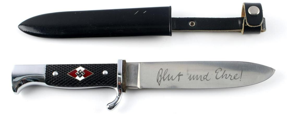 WWII THIRD REICH HITLER YOUTH KNIFE WITH SCABBARD: German WWII Hitler Youth HJ Knife & Scabbard. Measures 10” long overall. The etched steel blade reads ‘Blut und Ehre! (Blood and Honor!). It is maker marked ‘RZM M7/2 1937’. It measures 1” w