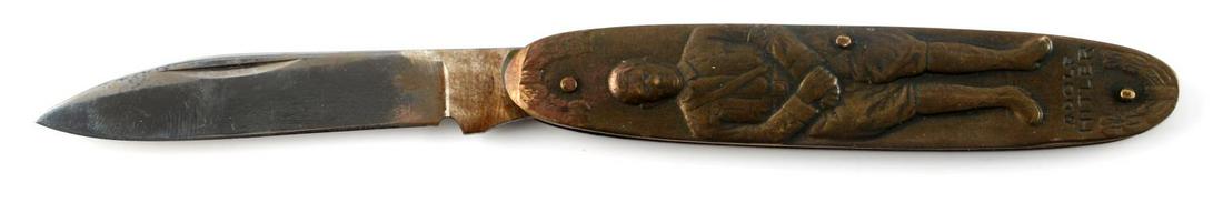 WWII GERMAN THIRD REICH ADOLF HITLER POCKET KNIFE: German WWII Dictator Adolf Hitler Pocket Knife. Measures 5/8” wide by 5 5/8” long with the blade open. The one side shows a full body image and reads ‘Adolf Hitler’ at the base. The other side