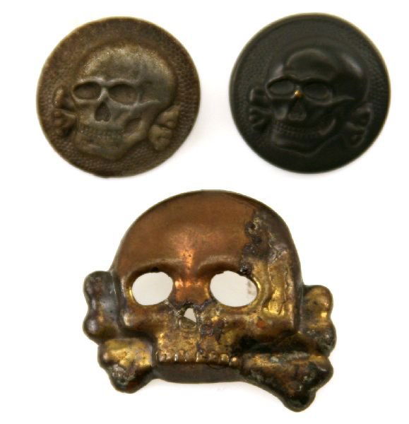 THIRD REICH ALLGEMEINE SS CAP SKULL & 2 BUTTONS: First pattern, (Circa 1923-1934), silver washed, stamped tombak construction Imperial Prussian Danziger style skull, with no bottom jaw. Most of the silver wash has gone on the face but is still evide