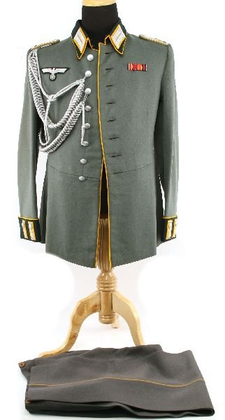 GERMAN 14TH CAVALRY REGIMENT OFFICERS M35 UNIFORM: Officers dress tunic and pants to an Oberleutnant of the 14th regiment of Cavalry. M35 pattern tunic in green with gold piping and silver bullion cuff and collar badges. Shoulderboards with "14". Brea