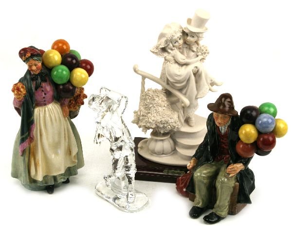 GIUSEPPE ARMANI & ROYAL DOULTON WATERFORD LOT: Armani "Florence" statue of a married couple standing 10 inches including the base. Royal Doulton "Balloon Man" and "Biddy Pennyfarthing". A Waterford Golfer. All have no damage.