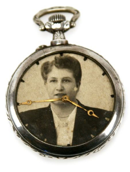 LONGINES GRAND PRIX PARIS 1900 SILVER POCKET WATCH: Coin silver pocket watch by Longines. Male and female lion design to the case. Inner case marked "Longines Grand Prix Paris 1900". Added photographs of women. Crystal is absent and spring is sticky.