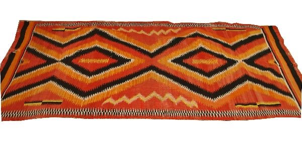 EARLY SUNBURST NAVAJO GALLUP THROW RUG: Navajo Gallup throw rug dating back to C.1900, hand spun in natural white, yellow, and red/orange dyed wool, but unique from the traditional in its geometric borders and sunburst color scheme. Rug has