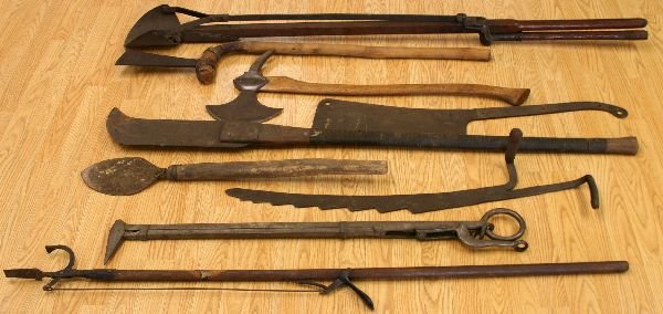 COLLECTION PRIMITIVE HAND TOOLS AND CUTTING BLADES: 9 primitive tools in this group,cutting blades diggers and even a rare broad axe3 feet to 6 feet in length dating back to the civil war
