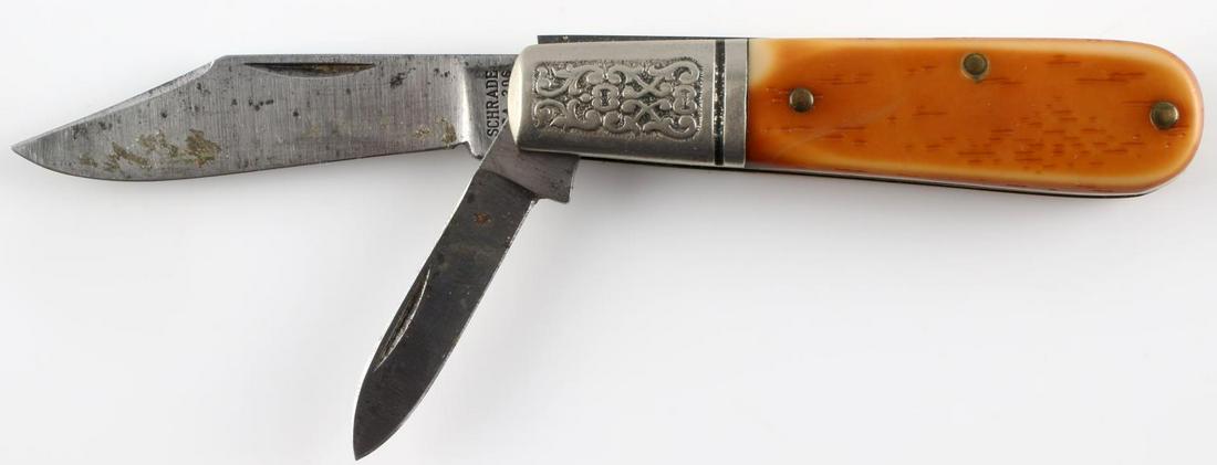 VINTAGE BONE HANDLED SCHRADE FOLDING POCKET KNIFE: Two-blade Schrade 206 pocket knife. Bone handle and engraved design. 2.25 and 1.5 inch blades, some residue. Overall good condition.