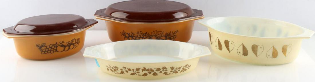 VINTAGE PYREX W 2 HARVEST DISHES WITH LIDS 1973: Models 043 and 045 casserole dishes with brown lids. Largest measures 13 inches long and 4.5 inches tall with lid on. Very good condition. Also Golden Acorn open baker (10.5 inch), and Deluxe Cinderel