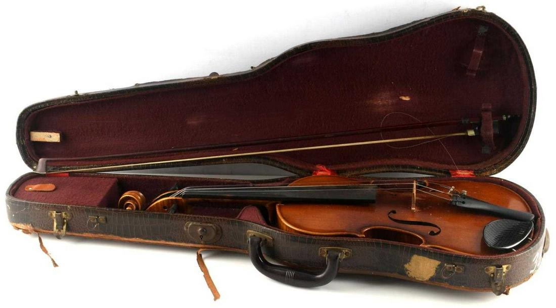 KARL HERMANN STRADIVARIUS MODEL VIOLIN 1956 W CASE: Ebony fingerboard, spruce top, flame maple back, burl maple neck. Slight chip to right and left sides of the top and scratching appears all around the body. Overall good condition. Comes with an allig