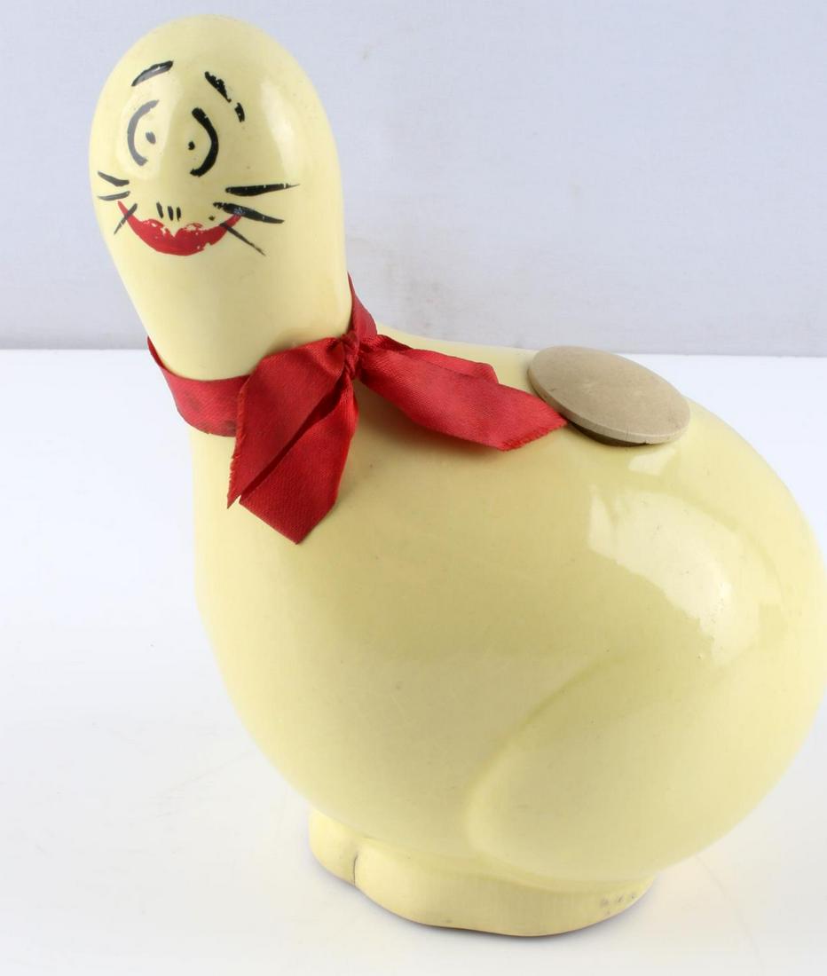 AL CAPPS THE SHMOO VINYL GLAZED CERAMIC FIGURINE: Al Capp's The Shmoo Vinyl Glazed Ceramic Figurine. Originally used as a Household Deodorizer, this item is a great collector's piece now. Missing the original "Household Deodorizer" sticker. This figu
