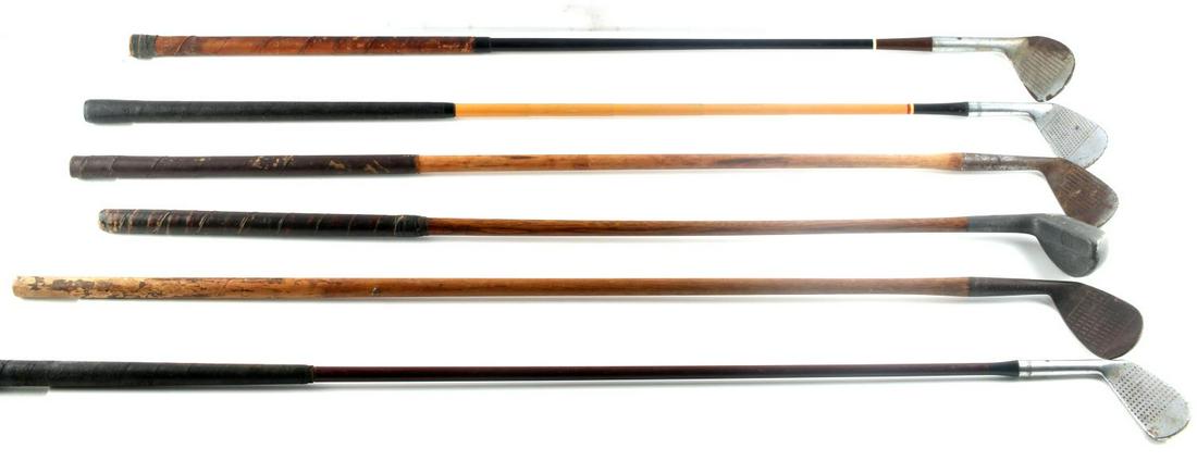 6 WOOD SHAFT GOLF CLUB LOT MILLS JC HIGGINS MOHAWK: All good to very good condition and include New Mills Ray Model putter, very good full grip, Wright & Dittson St. Andrews Mashie, partial grip, Elmwood Niblick composite shaft very good, J.C. Higgins 