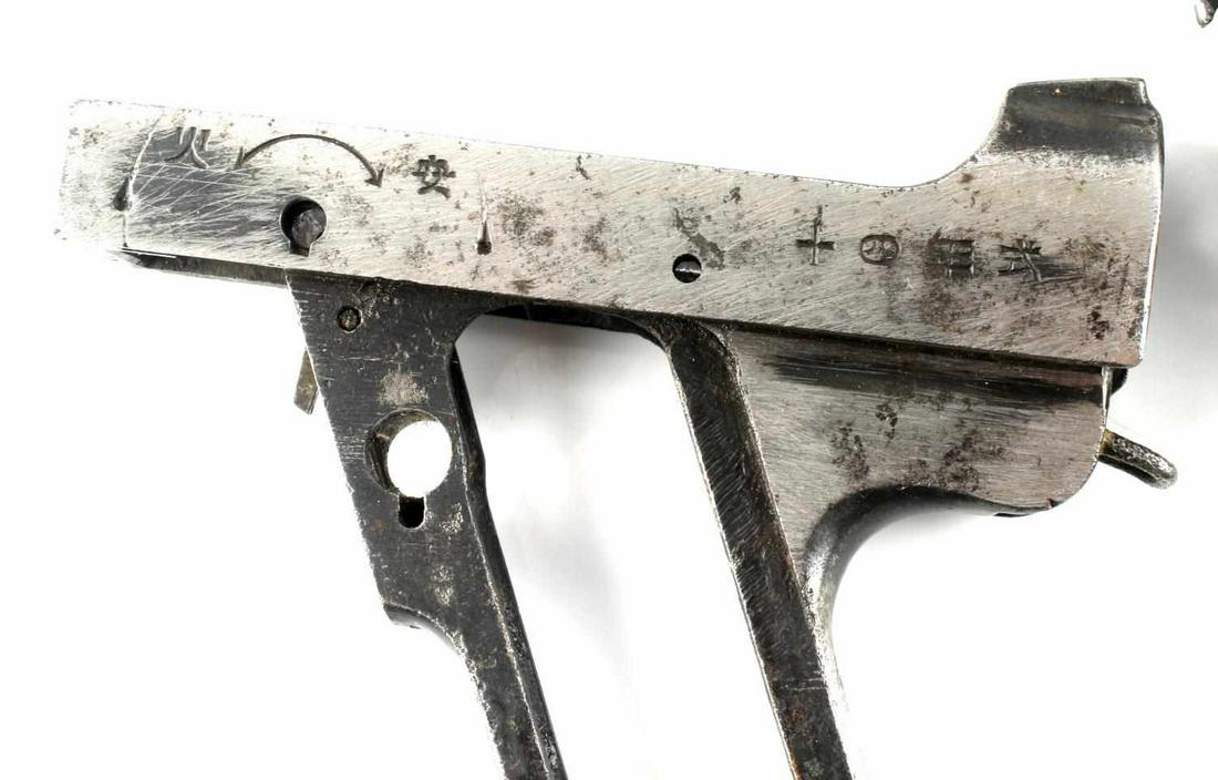 4 WWII JAPAN TYPE 14 NAMBU PISTOL FRAME RECEIVERS: Serial numbers included: 11872, 80917, 3235, and 61327. Tokyo and Kokubunji arsenals. One trigger and guard included. Fair to good condition. Caliber: 8mm Serial #: 11872, 80917, 3235, 61327