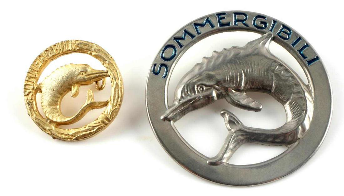 LOT OF 2 WWII ITALIAN ROYAL NAVY SUBMARINER PINS: Lot of 2 WWII Italian Royal Navy Submariner Pins. Feature the dolphin on the front and read "Sommergibli". The larger pin is approximately 1.75 inches in diameter and the smaller one measures approxim