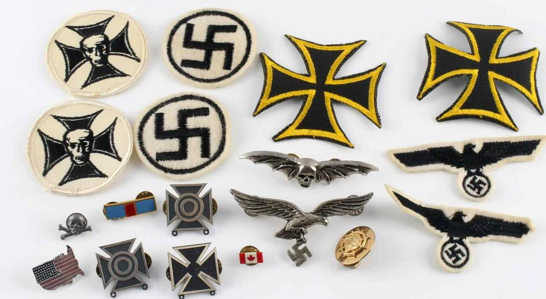 LOT OF 18 MISCELLANEOUS THIRD REICH USA PINS PATCH: Lot of 18 includes: 2 Iron Cross patches that don't fluoresce, 2 Iron Cross with skull patches that do fluoresce, 2 parteiadlers and 2 swastikas that do fluoresce, 3 rifle pins, a US flag pin, a Luftw