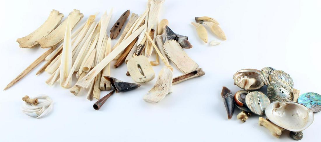 OVER 30 PIECES OF NATIVE AMERICAN SHELL BONE TEETH: Lot of 30+ includes an assortment of bone, shell, and teeth intended to be an homage to Native American tools. Very good condition. Measurements range .5 - 7.5 inches.