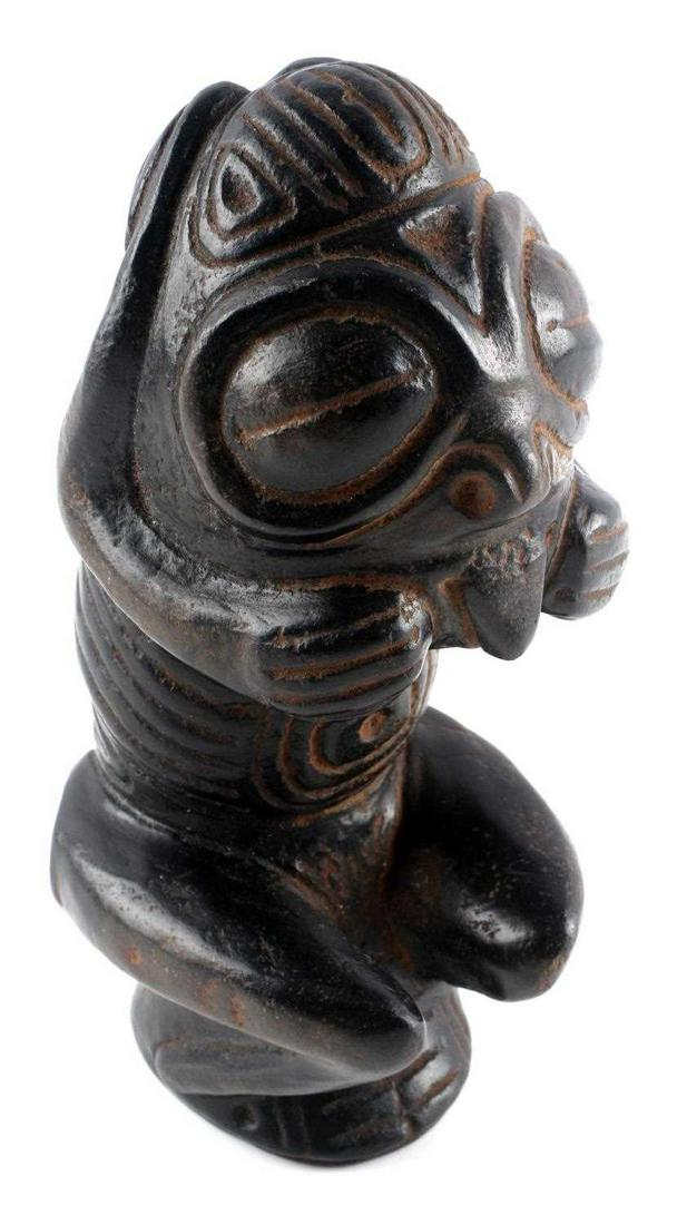 PRE COLUMBIAN TAINO ANIMATED BIRD MAN CEMI: An extraordinary full figured animated bird man cemi, most likely in a psychoactive trance as symbolized by slit and bulging eyes. Bird men were shamans or shaman /priests who’s souls were guided by