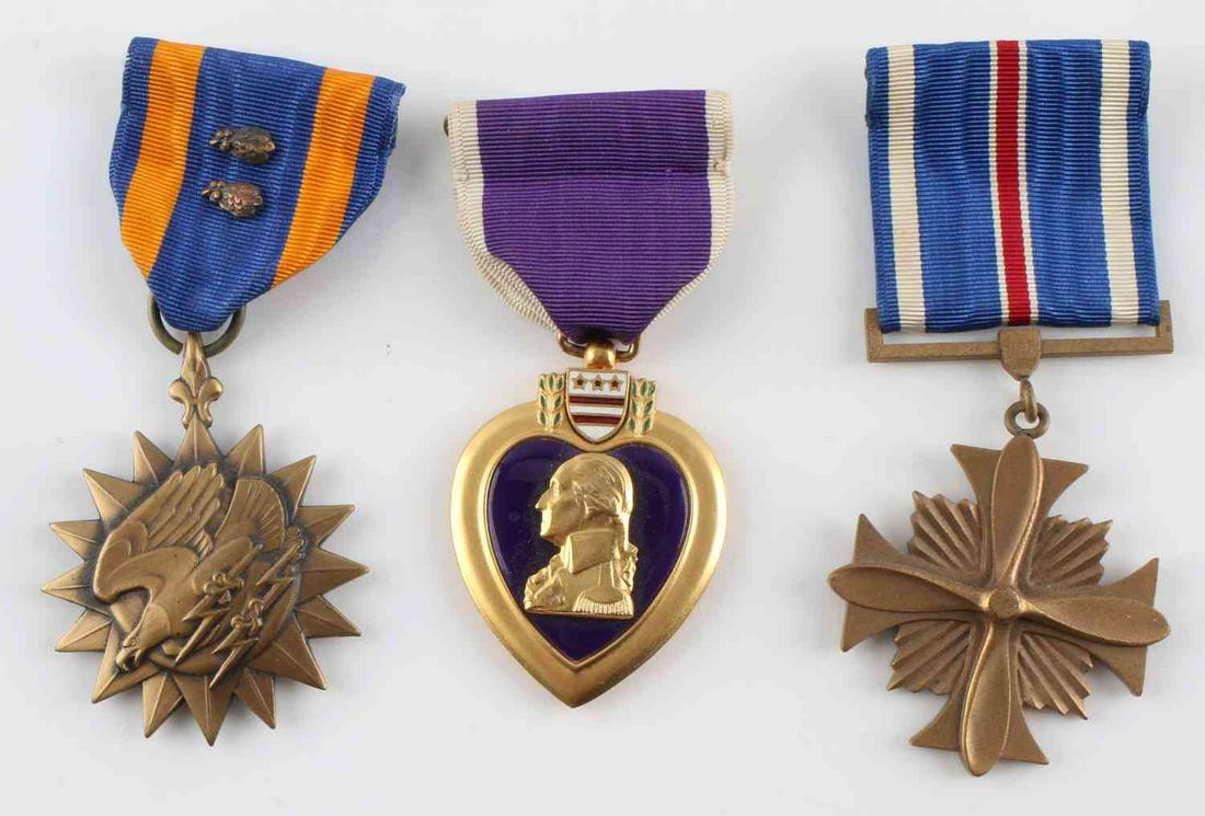 3 KOREAN WAR NAMED MEDALS PURPLE HEART AIR & DFC: Three medals: Purple Heart, Air, and Distinguished Flying Cross, all named to Paul S. Hungerford, Jr. Very good condition. Comes with reprinted article about his marriage to Patricia L. Flythe.