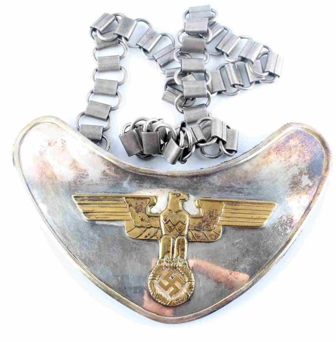 WWII GERMAN FELDHERNNHALLE GORGET WITH CHAIN: WWII German Feldherrnhalle gorget with chain. Eagle to center. Green non fluorescing wool backing with two hooks, one marked "RZM M1/123". Measures 170mm X 115mm and chain is 650mm. Unauthenticated, s