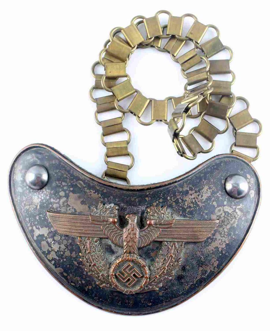 WWII GERMAN THIRD REICH POLICE PARADE GORGET: WWII German police gorget with chain. Copper NSDAP eagle with oak leaf wreath to center with black background. Green, non-fluorescing wool backing. Measures 150mm X 105mm and chain is 520mm. Paint on