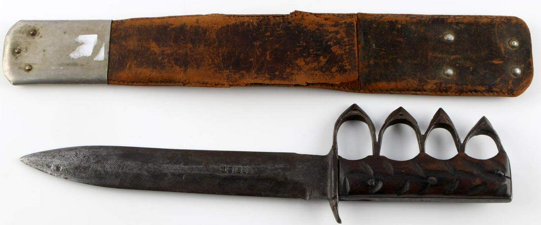 WWI WWII TRENCH MADE KNUCKLE DUSTER FIGHTING KNIFE: What a great blade, well crafted personal use knife, blade is stamped J.Geist. pretty heavy wear on scabbard but is original to the knife, double edged blade, custom grip. Measures 14 inches overall.T