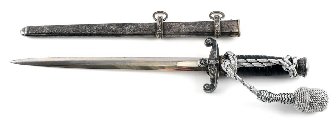 WWII THIRD REICH KLAAS 1ST MODEL RAILROAD DAGGER: Klaas 1st model original railroad dagger. Black grip. Stamped by Klaas. Usage wear to grip. Portepee fluoresces. Very good overall condition.
