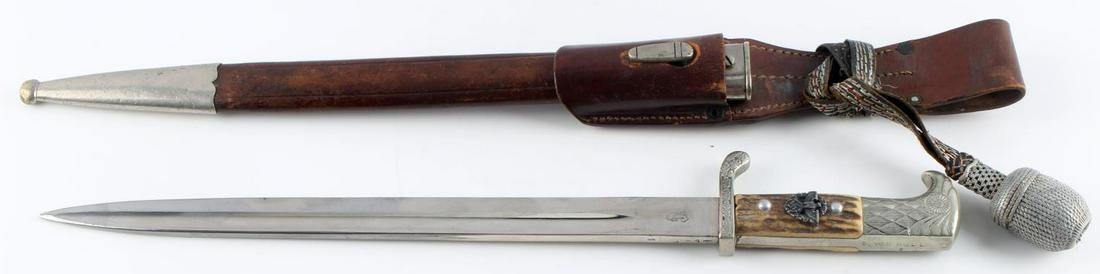 WWII GERMAN THIRD REICH POLICE DRESS BAYONET: WWII German police dress bayonet with scabbard, leather frog, and knot. Stag grip with steel construction. Riveted Eagle head grip with NSDAP eagle in oak leaf wreath. Grip named to "S. VON HULL". Cro