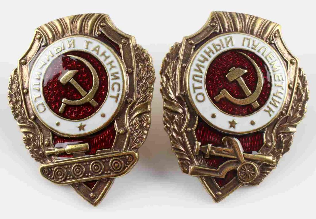 LOT OF 2 WWII SOVIET DISTINGUISHED SERVICE BADGES: Lot of 2 WWII Soviet distinguished service badges. Includes "Distinguished Tanker" and "Distinguished Machine Gunner". Measure approximately 1.5 X 2 inches. Very good condition. Unauthenticated; sold 