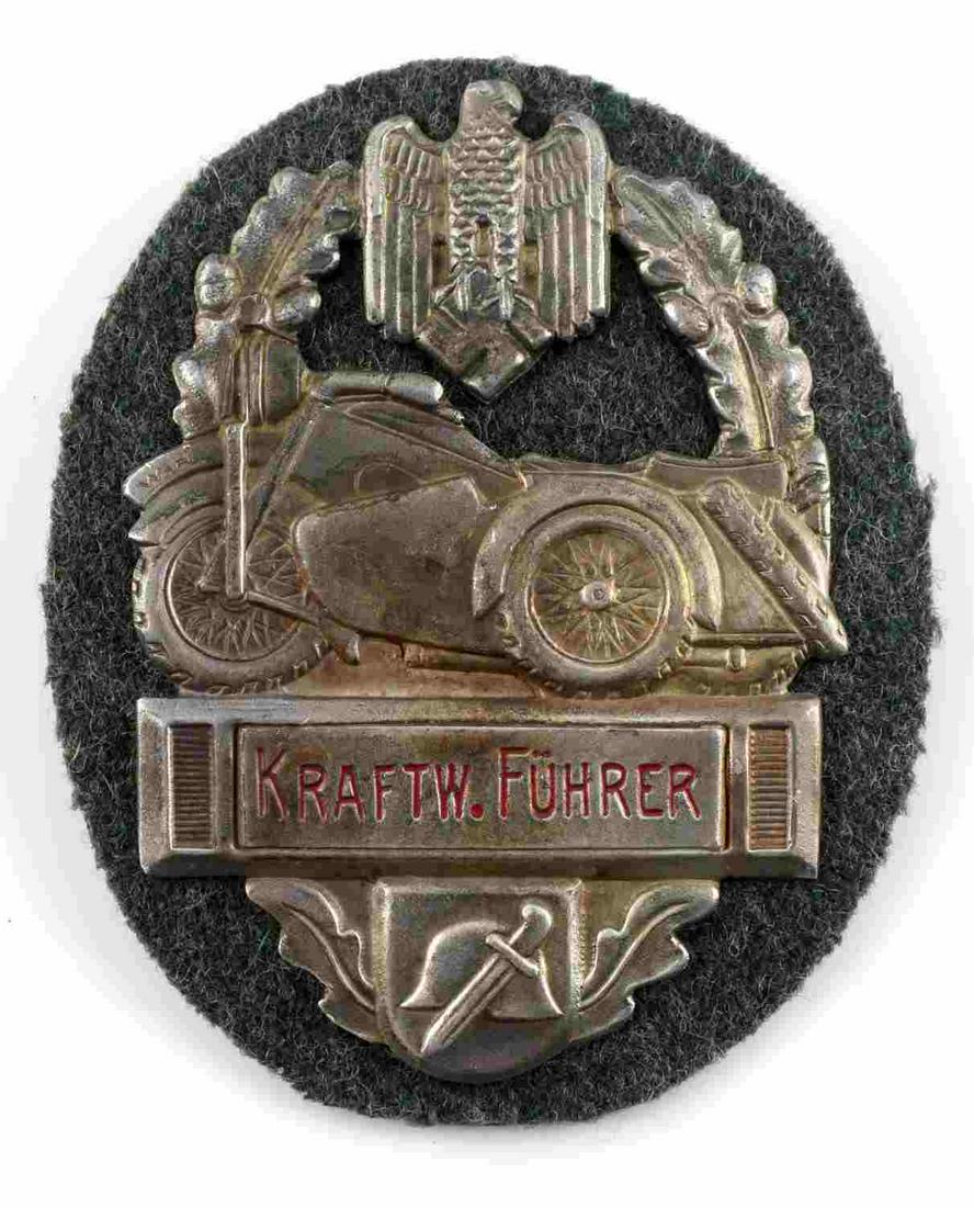 WWII GERMAN ARMY MILITARY BIKERS AWARD SHIELD: WWII German military biker's award shield on non fluorescing green wool. Reichsadler to top with motorcycle to center with KRAFTW. FUHRER below. Oak leaf wreath surrounding with helmet and knife to bo