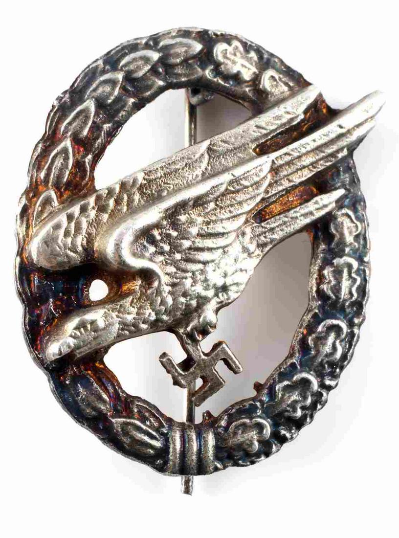 WWII GERMAN 3RD REICH LUFTWAFFE PARATROOPER BADGE: WWII German Luftwaffe paratrooper badge. Measures 1.5 X 2.25 inches. Has a 180 degree pin lie. Good condition with the exception of some discoloration. Unauthenticated; sold as is.0