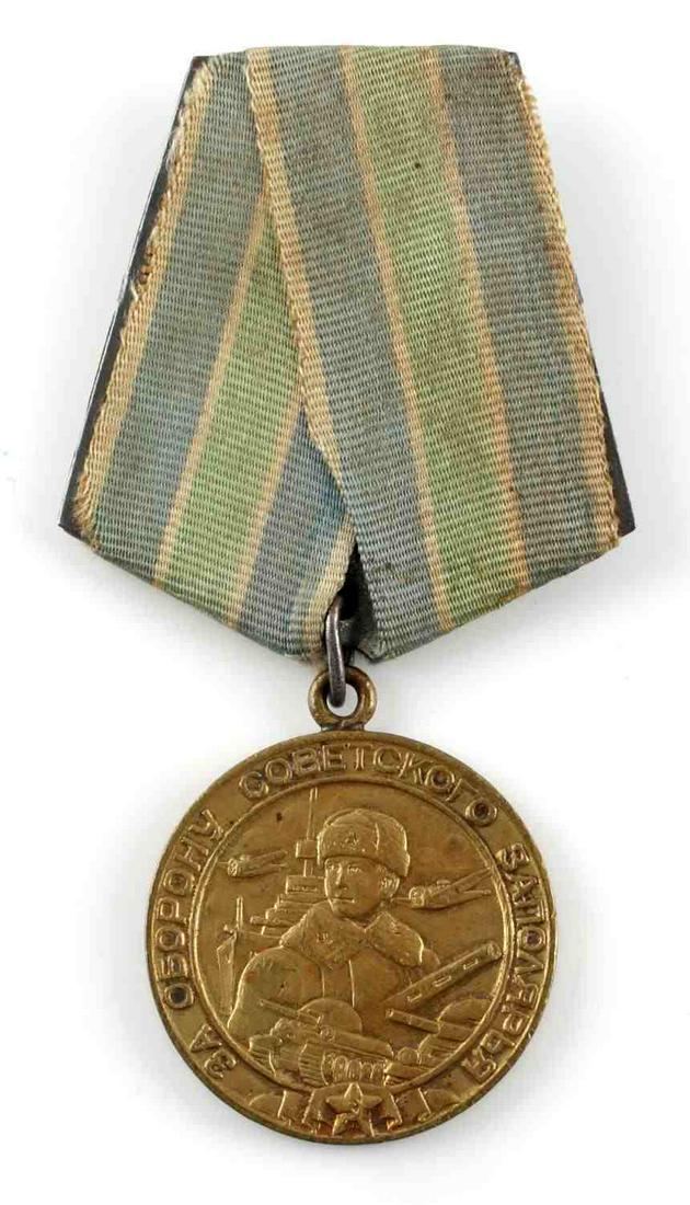 WWII SOVIET MEDAL FOR DEFENSE OF POLAR REGION: WWII Soviet Russian medal for the "Defense of the Polar Region". Measures approximately 3 inches tall and 1.25 inches in diameter. Very good condition overall. Unauthenticated; sold as is.0