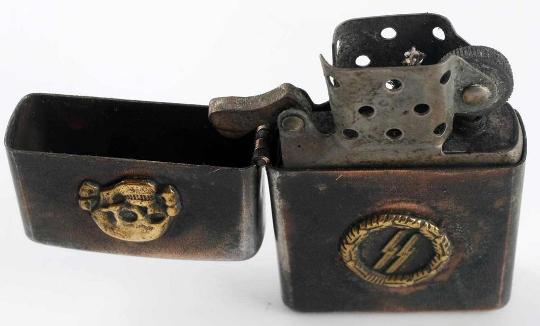 WWII GERMAN 3RD REICH WAFFEN SS CIGARETTE LIGHTER: WWII German Waffen SS cigarette lighter. Zippo style lighter with a Totenkopf and the SS emblem on the front. Measures 1.5 X 2.25 inches. Good condition overall. Unauthenticated; sold as is.This lot h