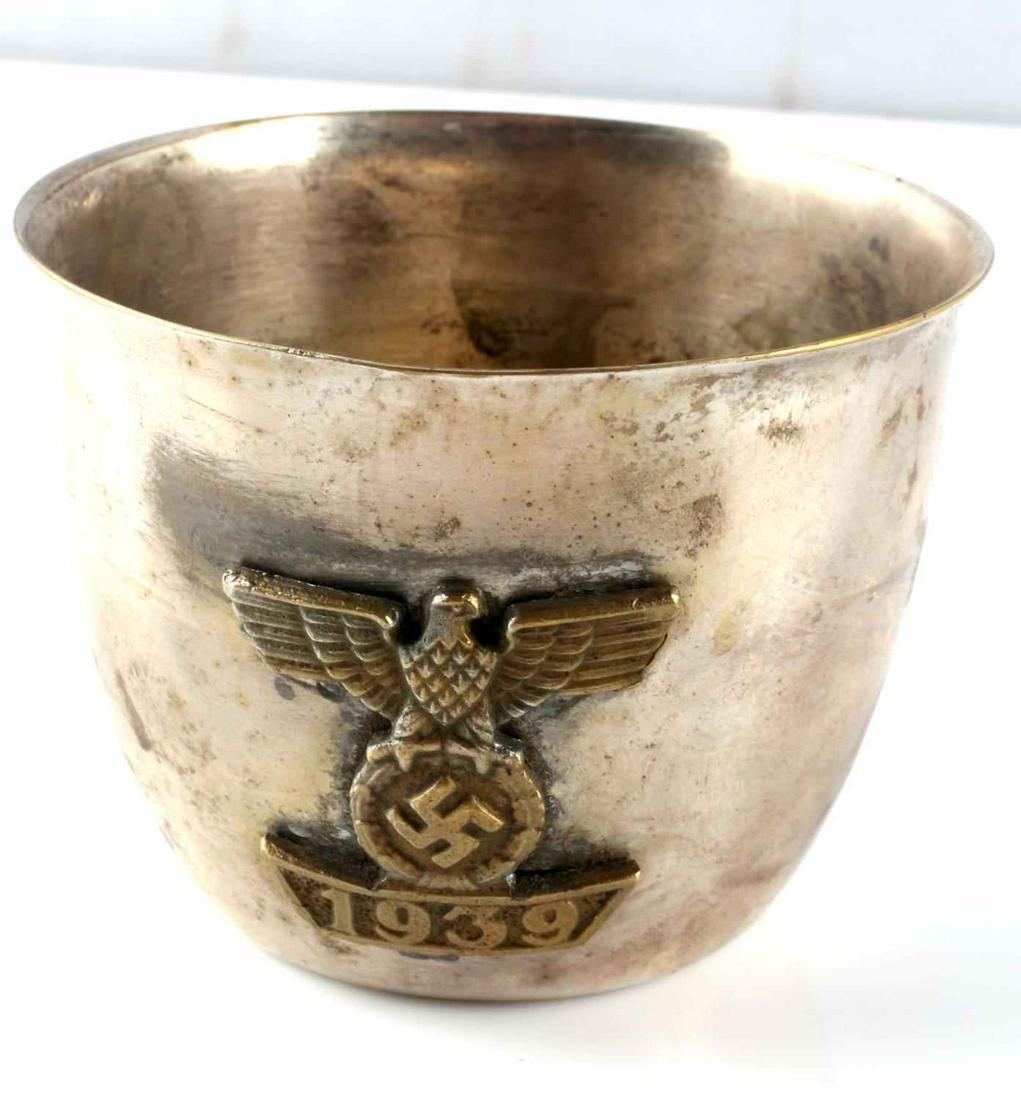 WWII GERMAN THIRD REICH SILVER REICHSADLER CUP: WWII German silver Reichsadler cup. Measures 2.25 inches tall with a 2.75 inch diameter opening. Marked "WMF" on the bottom. Very good condition. Unauthenticated; sold as is.This lot has a reserve.